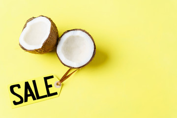 summer vacation, travel, tropical beach, summertime holidays seasonal sale, shopping. special offer, discount symbol. price tag and halves of coconut on yellow background, shopping banner template