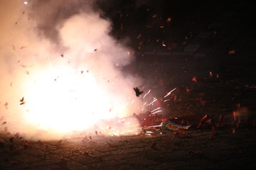 loud chinese crackers in a row are exploding during New Years Eve in the Netherlands where this...