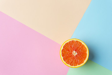 summer vacation, exotic tropical fruit minimal concept. creative layout of orange on multicolored...