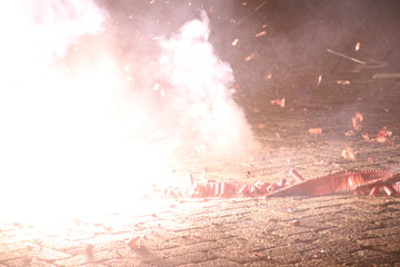 loud chinese crackers in a row are exploding during New Years Eve in the Netherlands where this...