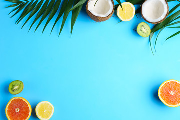 tropical beach, summer vacation, ocean shore, sea coast, cocktail, travel and relaxation. palm leaves, coconut and exotic fruits slices. creative minimal summer idea.
