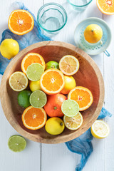 Healthy oranges, limes and lemons with on wooden table