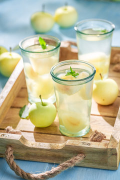 Tasty apple juice with apples and mint