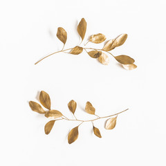Eucalyptus leaves on white background. Wreath made of golden eucalyptus branches. Flat lay, top view, copy space, square