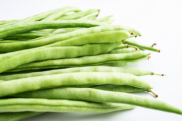 Fresh green beans on white background