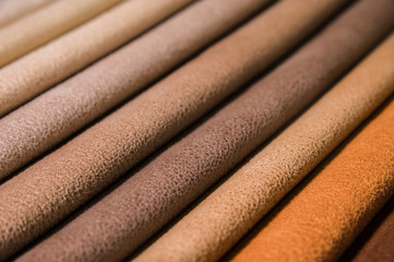 Colorful and bright fabric samples of furniture and clothing upholstery. Close-up of a palette of textile abstract stripes of different colors