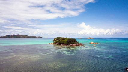  A small island with a blue lagoon somewhere in the Seychelles