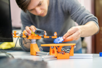 young male work with technologic 3d scanner in university b