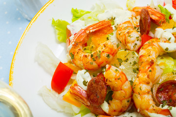 Shrimps, chorizo sausages and vegetables