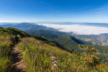 Tourists and walking guides visit Kew mae pan nature trail sky with white mist and sunrise, Doi...