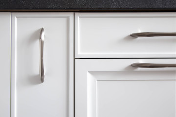 Kitchen cabinets with classic traditional fronts, close-up.  