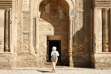 Woman Travaler in Central Asia Mosque Vault Entrance. Caucasian Female Standing on Historical Landmark