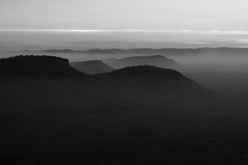 Fototapeta na wymiar Sunrise in the mountains landscape, fog and cloud mountain valley landscape, View from Pha Mo I Daeng, Khao Phra Wihan National Park, sisaket, thailand
