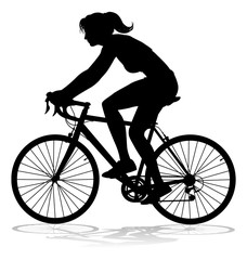 A woman bicycle riding bike cyclist in silhouette