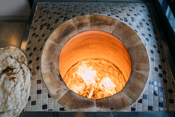 Traditional turkish wood fired stone brick oven and pita or pide bread dough. This stone oven for...
