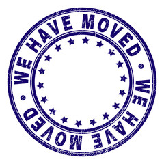 WE HAVE MOVED stamp seal imprint with distress texture. Designed with round shapes and stars. Blue vector rubber print of WE HAVE MOVED title with dust texture.