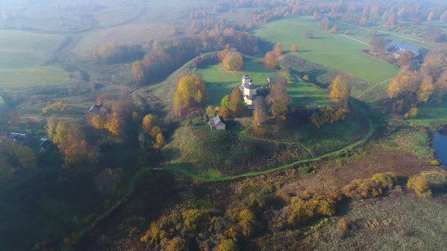 View on the Gorodishche Voronich and Trigorskoe, October morning (aerial video). Pushkin Mountains, Russia 