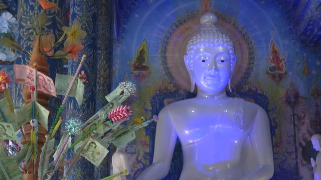 Money offerings to Buddha. Wat Rong Sear Tean (Blue temple). Chiang Rai