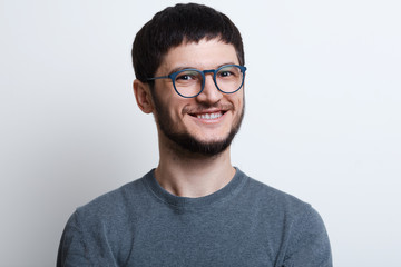 Portrait of handsome smiling guy over white background