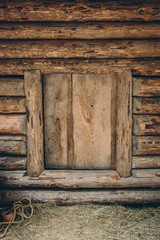 Small entrance door of old traditional wooden log house