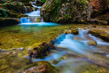 small river rushing through the mountain canyon