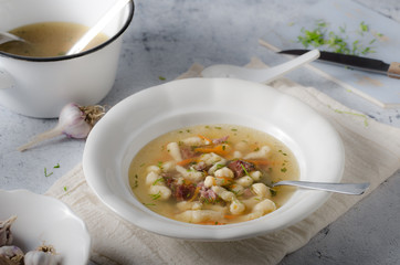 Smoked meat soup with pasta inside