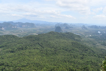Naklejka premium Panorama view from a big rock over Krabi at the jungle hiking trail to dragon crest in Khao Ngon Nak in Krabi, Thailand, Asia