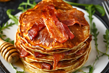 Pancakes with crispy bacon and maple syrup in a plate. Morning Breakfast