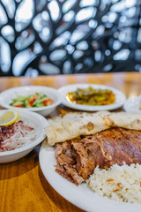 Turkish Doner Kebab, Shawarma or Gyros with rice and salads. Traditional Turkish Doner Kebab meat, iskender, shawarma or gyros in restaurant