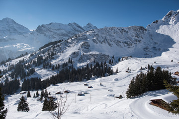Winter landscape on a beautiful sunny day in the Swiss Alps, between Allmendhubel and Murren.