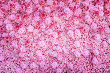 Colorful multicolored ornamental of beautiful pink roses blooming patterns group with carnation texture on wall for background
