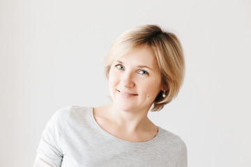 Middle aged woman on light background