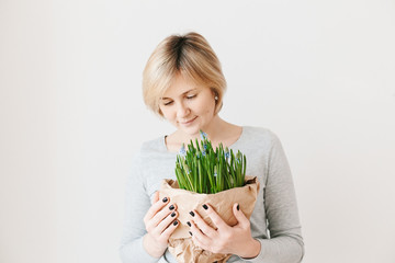 Middle aged woman on light background