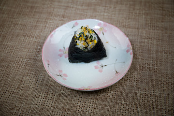 Close up view of plate with japanese food inside. Japan traditional food on wooden table.