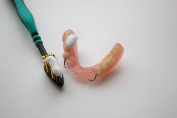 dental prosthesis and oral care with toothbrush and dental floss