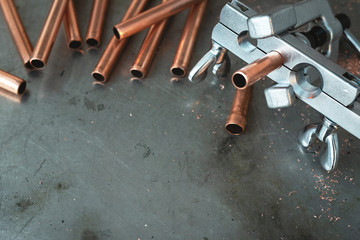Pipe rammer tool on a fitter workbench. Pipework concept background with copy space.