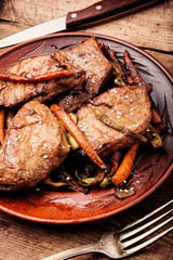 Beef steaks with vegetables