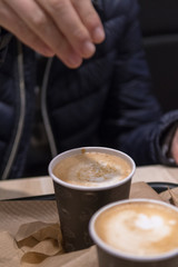 Adding sugar to latte coffee