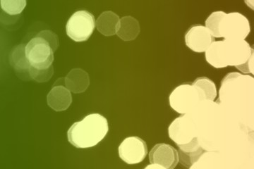 green bokeh effect of sparkling sparks on black texture - nice abstract photo background