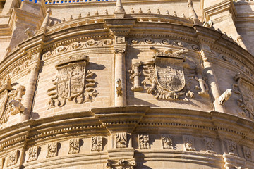 Obraz premium Detail of the cathedral with the image of the coats of arms - the main attraction of the city of Seville, Andalusia, Spain