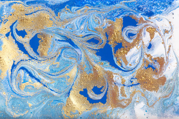 Blue and gold marbling pattern. Golden marble liquid texture.