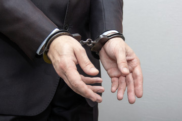 The arrest of a civil servant and a businessman, on suspicion of corruption
