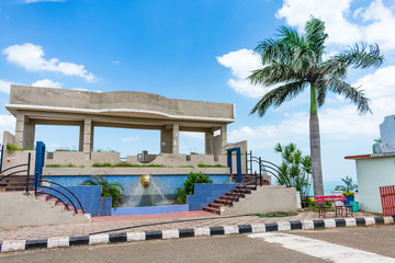 Shooting studio building with a coconut tree looking awesome.
