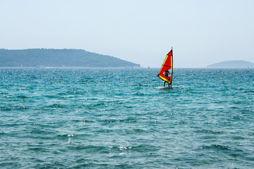 A picture of a windsurf on the sea during the hot summer day. Pictured in Croatia. 