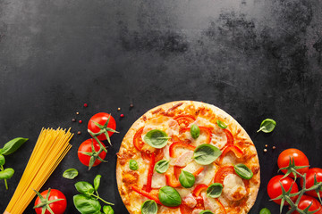 Tasty vegetarian pizza on dark background