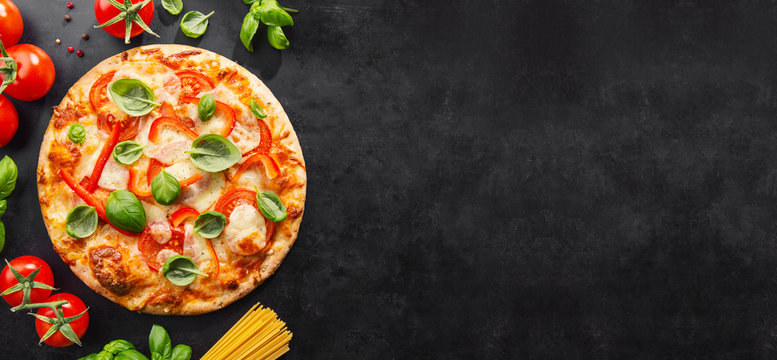 Tasty vegetarian pizza on dark background