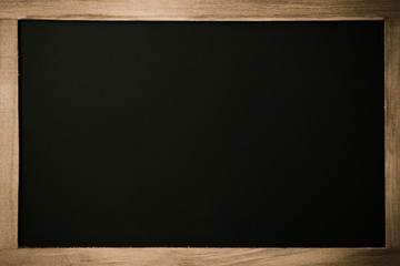 Blank chalkboard with wooden border.