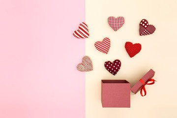 Pillow balloon hearts floating out of the gift box. Creative thinking about love and Valentine's day. Minimal style.