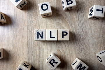 NLP word from wooden blocks on desk