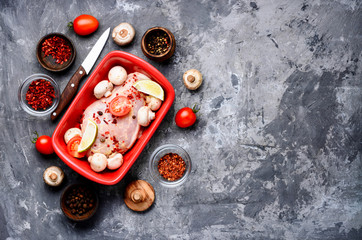 Raw chicken in baking dish